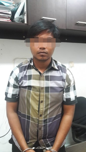 Tersangka MF saat diamankan di Sat Reskrim Polres Kampar (ist)